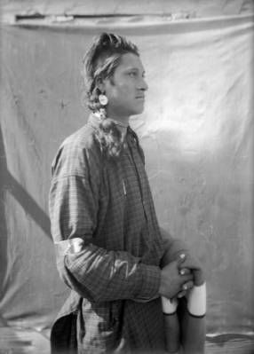 Johnnie A Native American Man On The Flathead Indian Reservation In Johnnie A Native American Man On The Flathead Indian Reservation In Western Montana Holds Folded Blanket Over His Left Arm While Standing Front Of