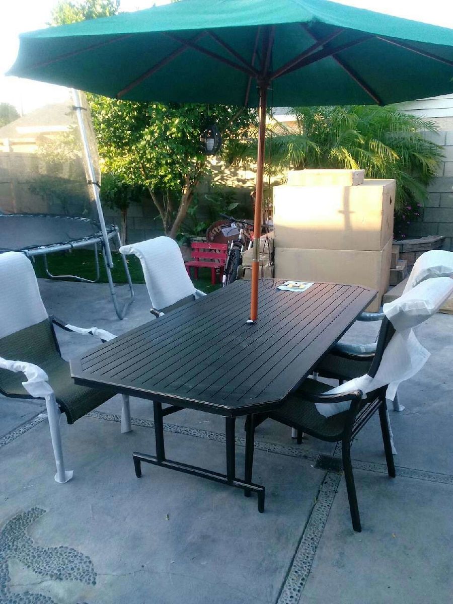 Used black wooden patio table set for sale in Colton Wooden patios
