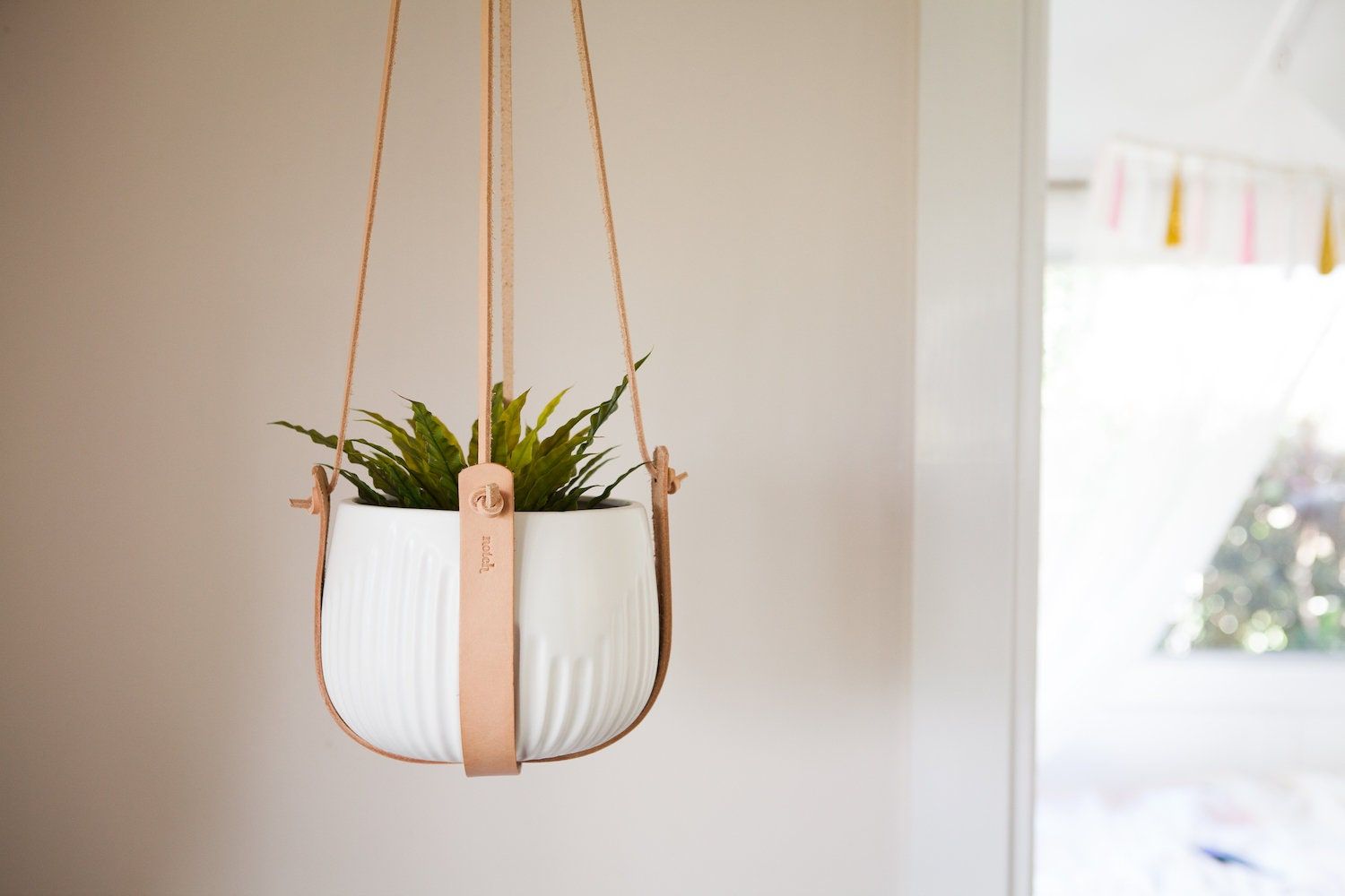 This indoor hanging planter is a beautiful addition to any home, it looks great in the living room, bedroom or bathroom, it also brings an office space to life. They can be hung from the ceiling or off a wall. This plant hanger is a great gift idea for others (or yourself), and a wonderful way to brighten up a room. Made with vegetable tanned leather and finished with a brass ring. These plant hangers can comfortably hold any size from 15-30cm wide pots, if you have a larger pot than this I am a Indoor Plant Hangers, Hanging Planters Indoor, Hanging Plant Holder, Hanging Plants, Plant Holders, Macrame Plant Hanger, Support Plante, Hanger Home, Pot Hanger
