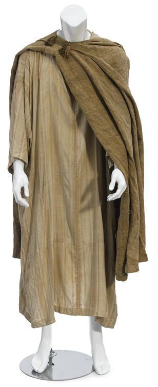 Ben-Hur costume worn by Charlton Heston as 'Judah Ben-Hur'. Beige striped cotton hooded caftan with beige piping and tassel on hood, accompanied by a rough tan linen cape with embroidered decoration and two tassels at the neck #benhur1959 Ben-Hur costume worn by Charlton Heston as 'Judah Ben-Hur'. Beige striped cotton hooded caftan with beige piping and tassel on hood, accompanied by a rough tan linen cape with embroidered decoration and two tassels at the neck #benhur1959 Ben-Hur costume worn b #benhur1959