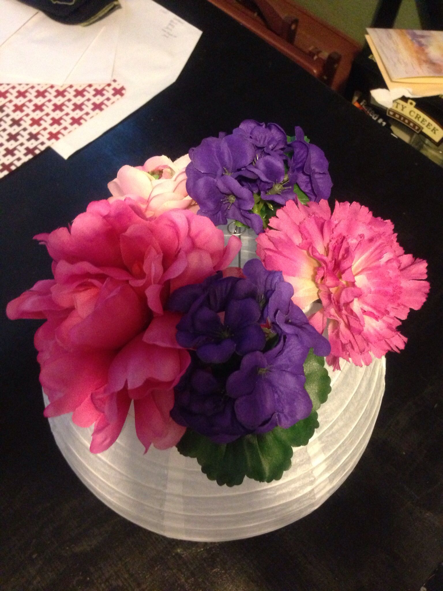 Use paper lanterns as a vase for wedding table decorations Shop