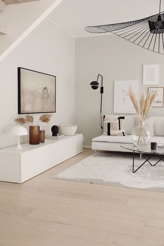 White Scandinavian Styled Living Room Interior - Clearing Clutter For Clarity. A white and organized Scandinavian living room that is neat, beautifully styled and decorated. The white living room id decorated with thoughtful modern but muted touches of accessories and black accents to create a calming and relaxed interior for everyday living. @chloedominik #organizedinteriordesign #organizedlivingroom #scandinavianinterior #scandinavianlivingroom #whitelivingroom Living Room Decor Modern, Living Room Inspo, Living Room Decor Apartment, Apartment Interior, Living Room Inspiration, Home Living Room, Interior Design Living Room, Living Room Designs, White Scandinavian Living Room