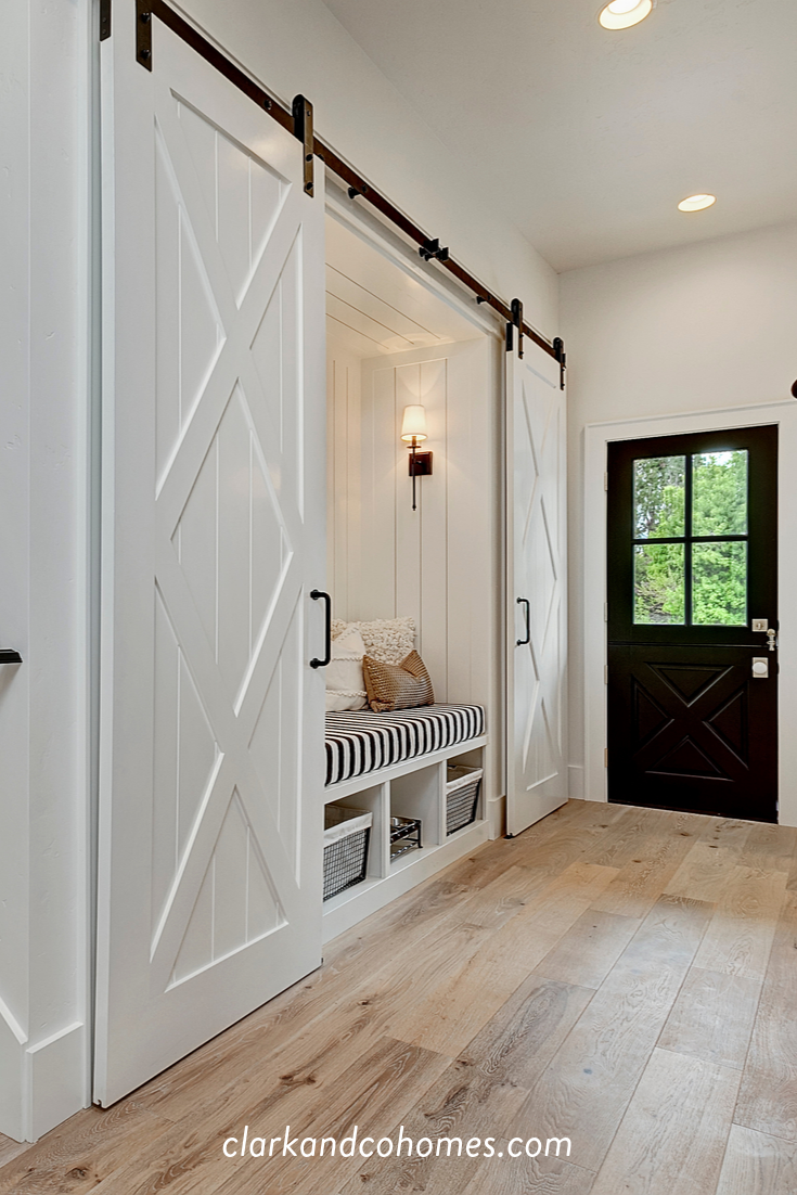 the heartland double barn doors slide apart to reveal a built in bench with cubbies below for home builders double barn doors house narrow sliding barn door on the heartland double barn doors slide apart to reveal a built in bench with cubbies below for home builders double barn doors house the heartland double barn doors slide