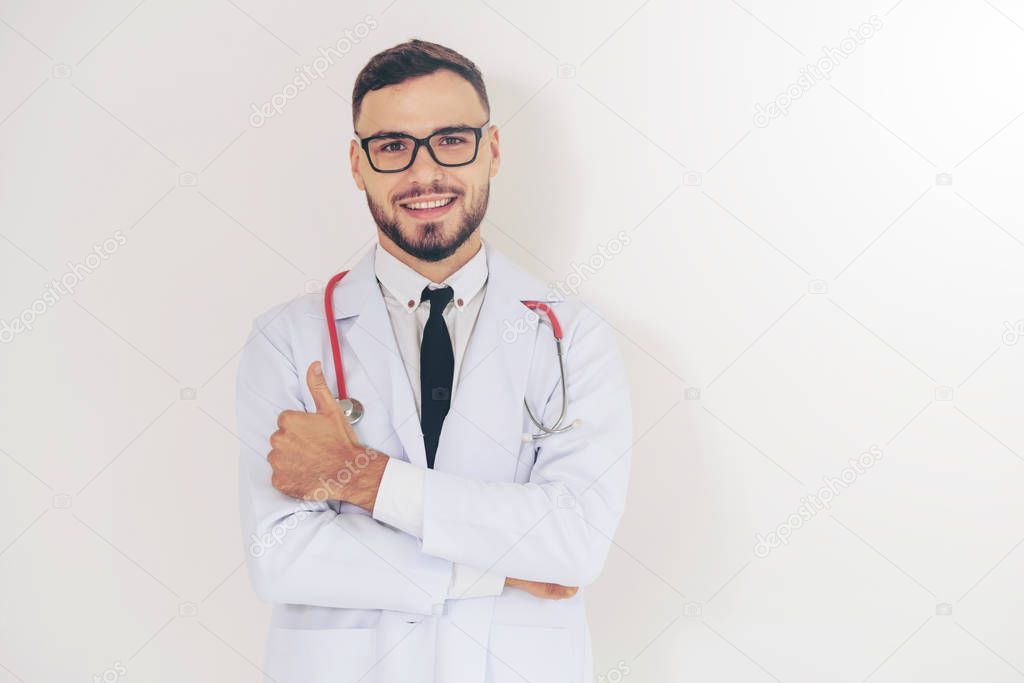 Doctor Showing Thumbs Up On White Background Stock Photo
