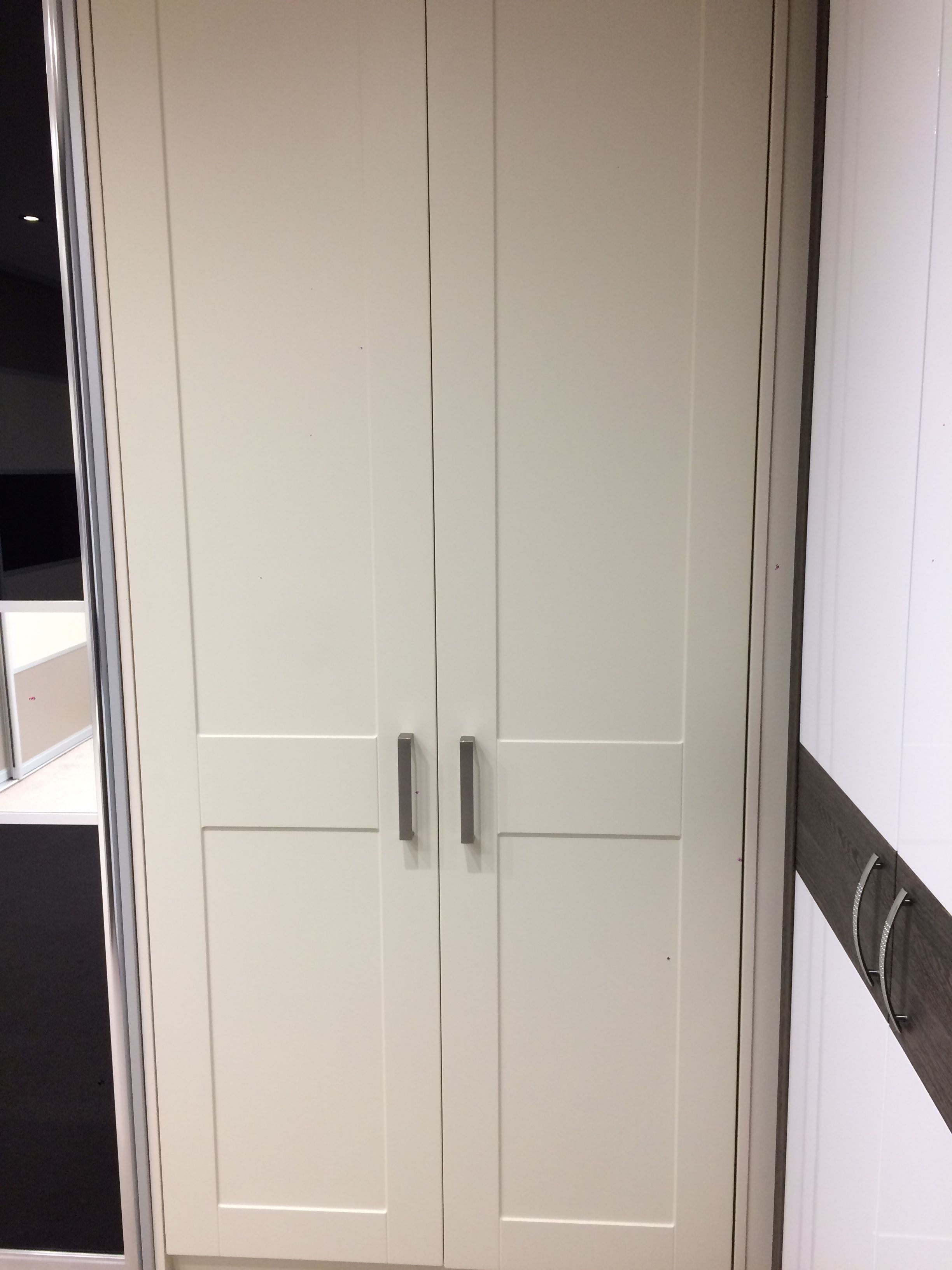 Hinged unit with shaker style doors in Mussel. | Shaker style doors