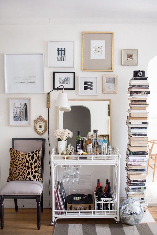 10 Beautifully Styled Bar Carts Worth Throwing A Party For My New Love The Sapien Bookcase Next To Louis Xvi Neoclical Chair Bar Cart Hanging Lamp And Gallery Wall Plus Disco Ball Perfection