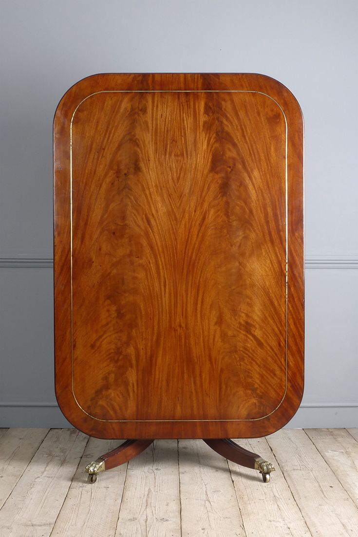 Small antique dining table. Stunning brass inlaid Regency mahogany breakfast table, with good colour. The highly figured tilt top, raised on a turned pedestal and four hipped splay legs capped with lion claw castors. Circa. 1820 Regency Furniture, Georgian Furniture, Antique Furniture, Demilune Table, Antique Dining Tables, Table Cards, Tilt, Pedestal