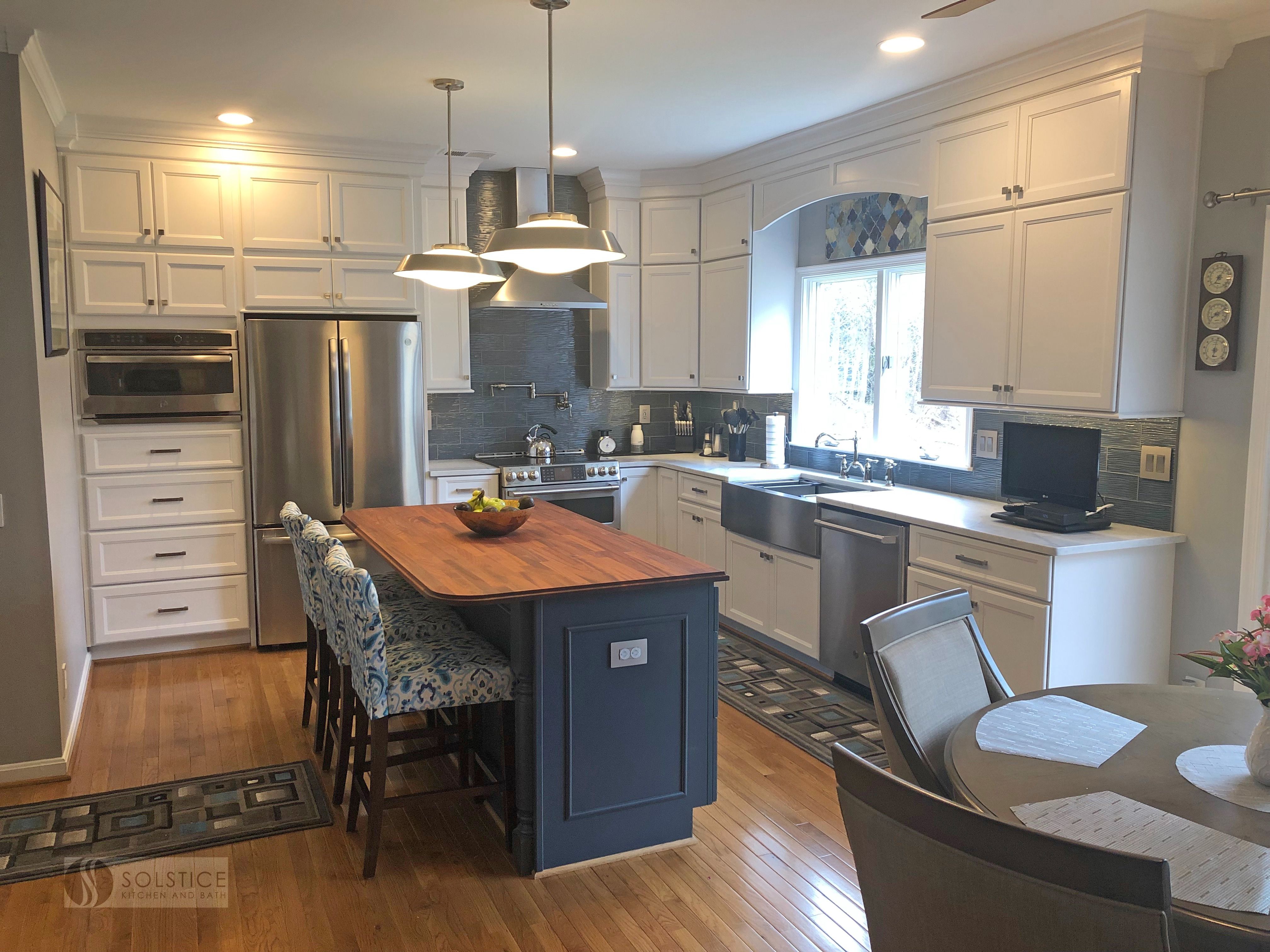 The HomeCrest by @MasterBrandCabinet stunning blue kitchen island with ...