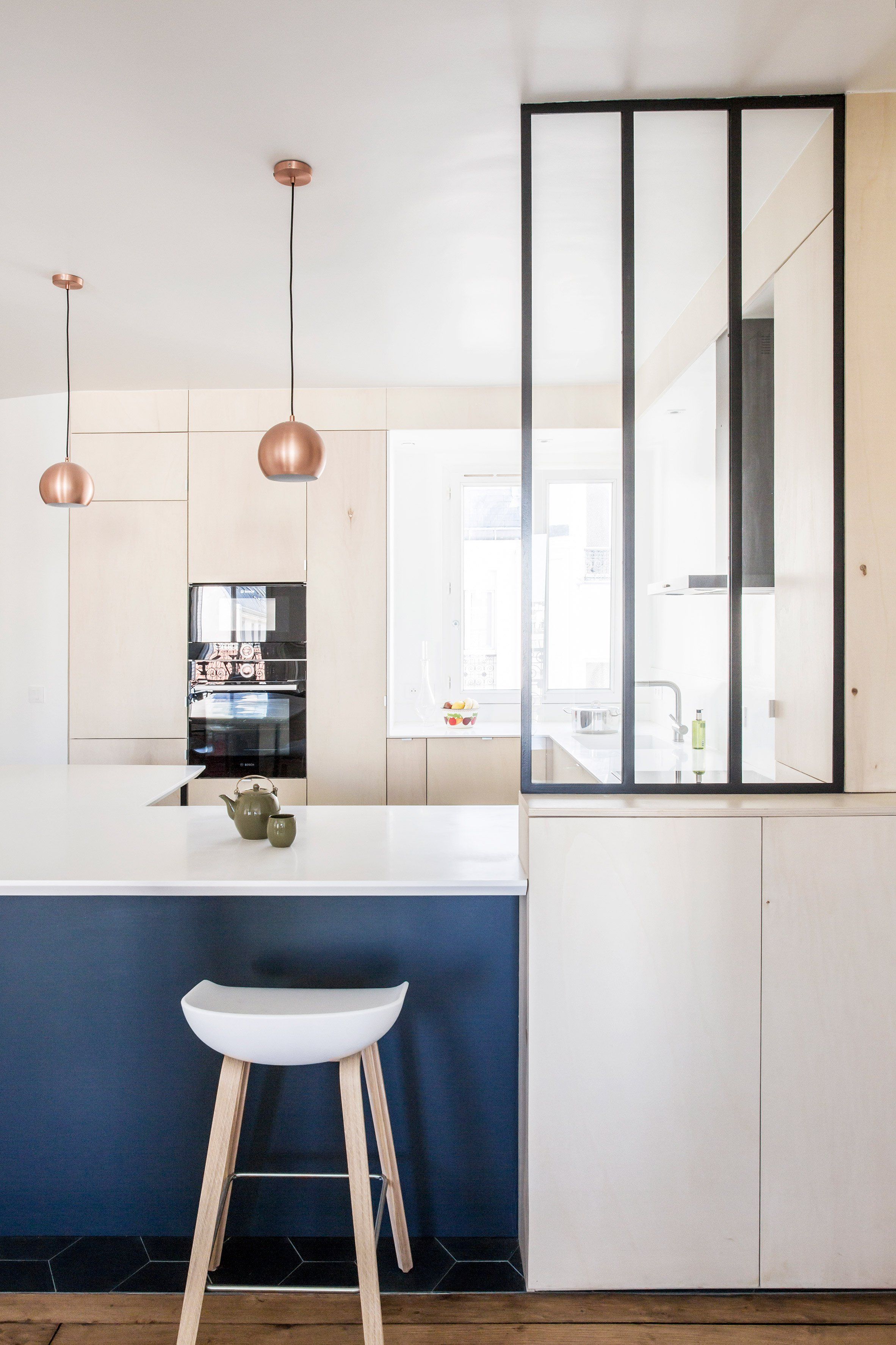 Anne laure dubois uses dark blue tiles and poplar plywood to ...