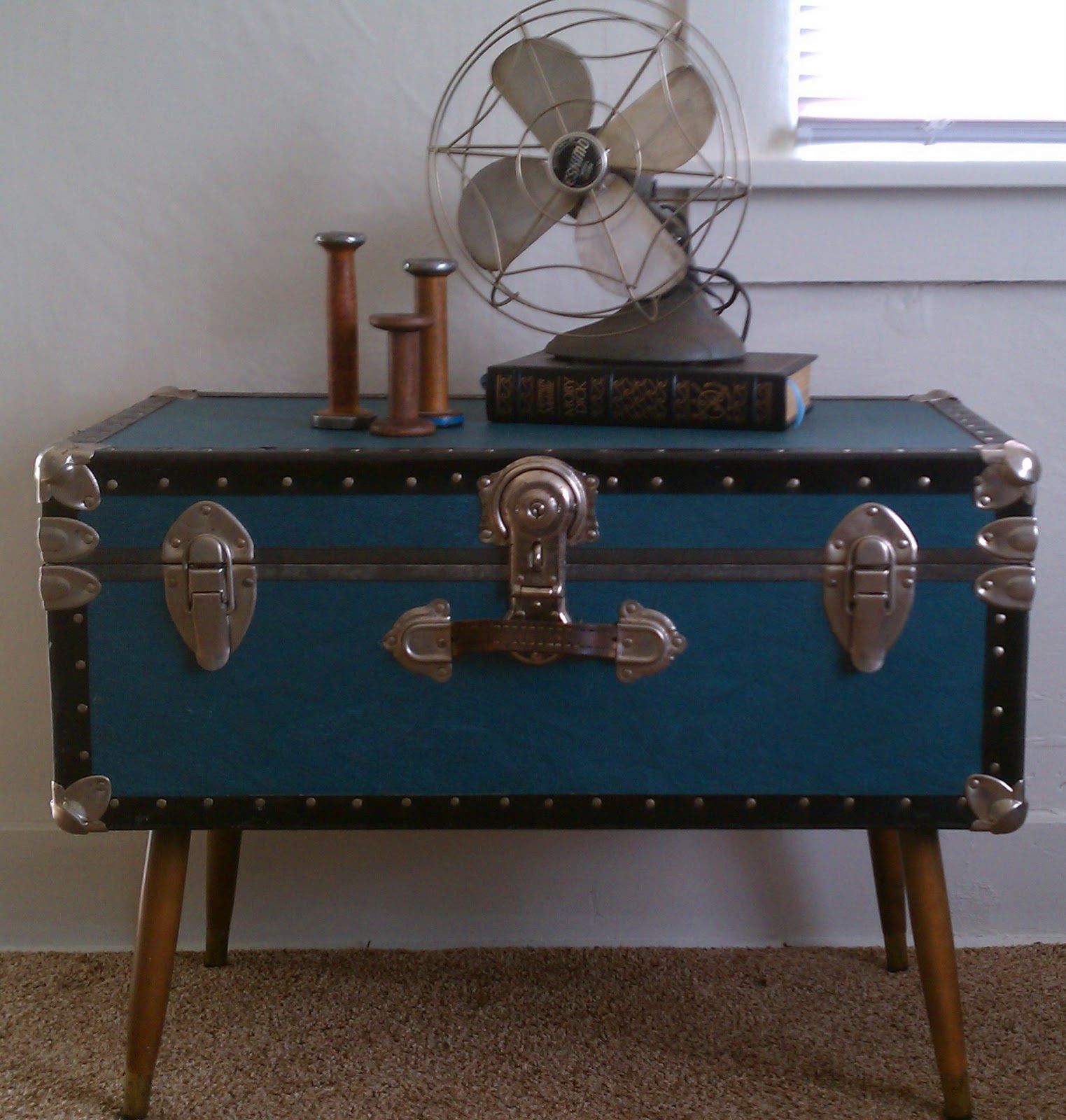 Low Stand Fan On Steamer Trunk Coffee Table In Bedroom With Beige Low Stand Fan On Steamer Trunk Coffee Table