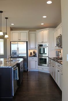 Kitchens by deane two tone cabinets. dark island with white ...