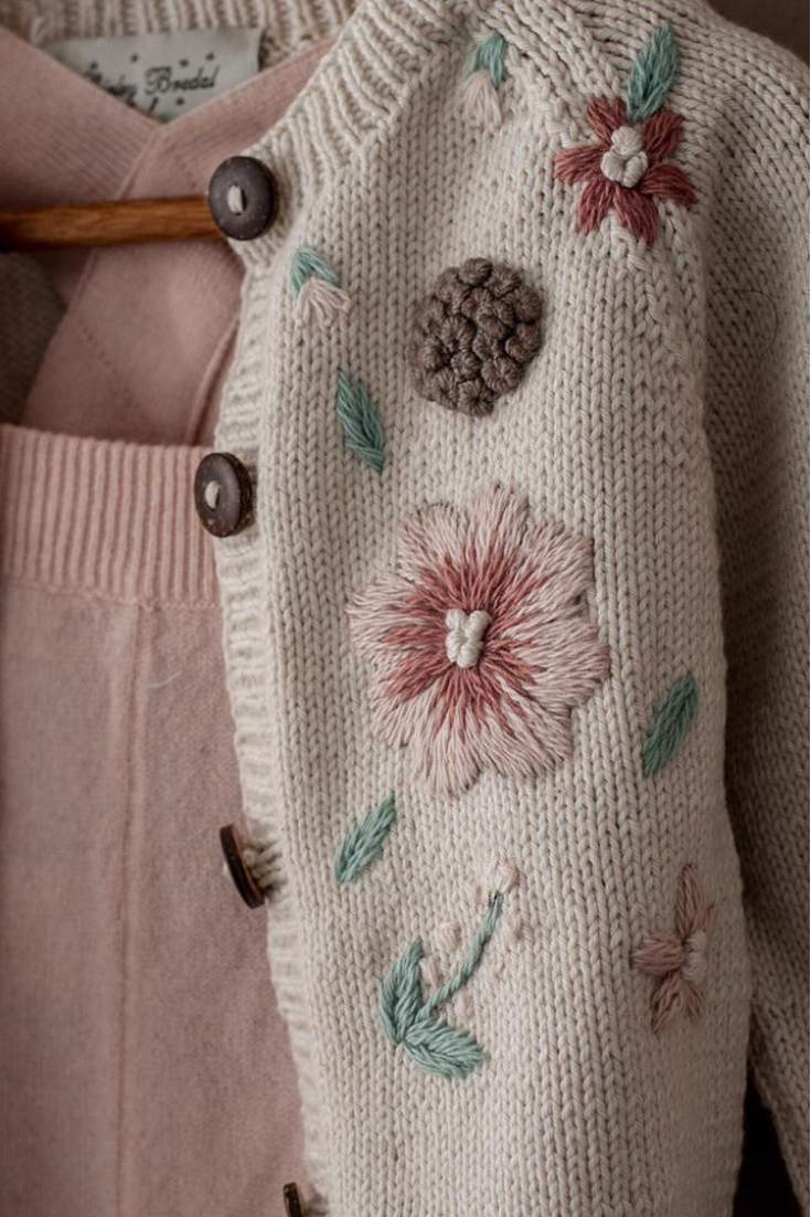 Hand embroidery details on our cotton Flora Summer cardigan for girls in cream w...
