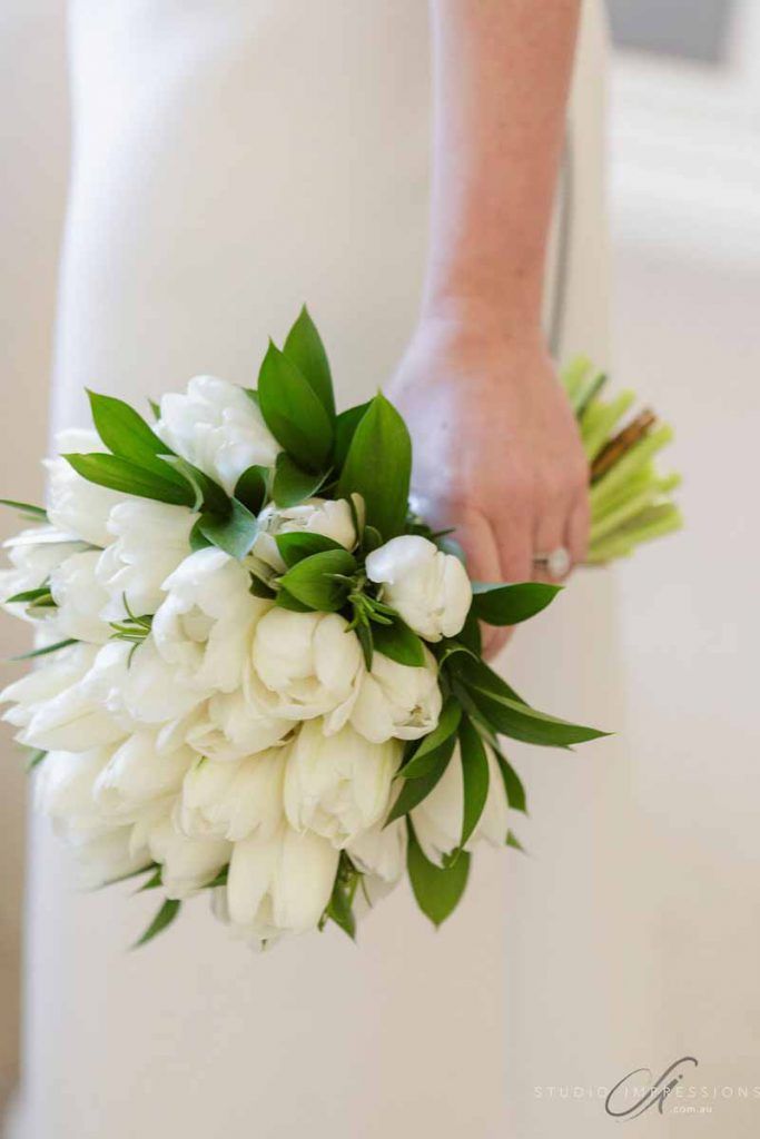 A winter wedding with a luxurious and feminine feel, the brides favourite flowers were tulips, simple tulip bridal bouquet #willowbud #modernflowers #receptionflorals #whitetulips #centrepieceflorals #hangingflorals #spicesclovellyestate #simplystyleco #modernweddings #sunshinecoastweddings Tulip Bouquet Wedding, White Tulip Bouquet, Brides Flowers Bouquet, Modern Wedding Bouquets, Wedding Flowers Tulips, Simple Wedding Flowers, Winter Wedding Bouquet, Wedding Bouquets Bride, Bride Flowers