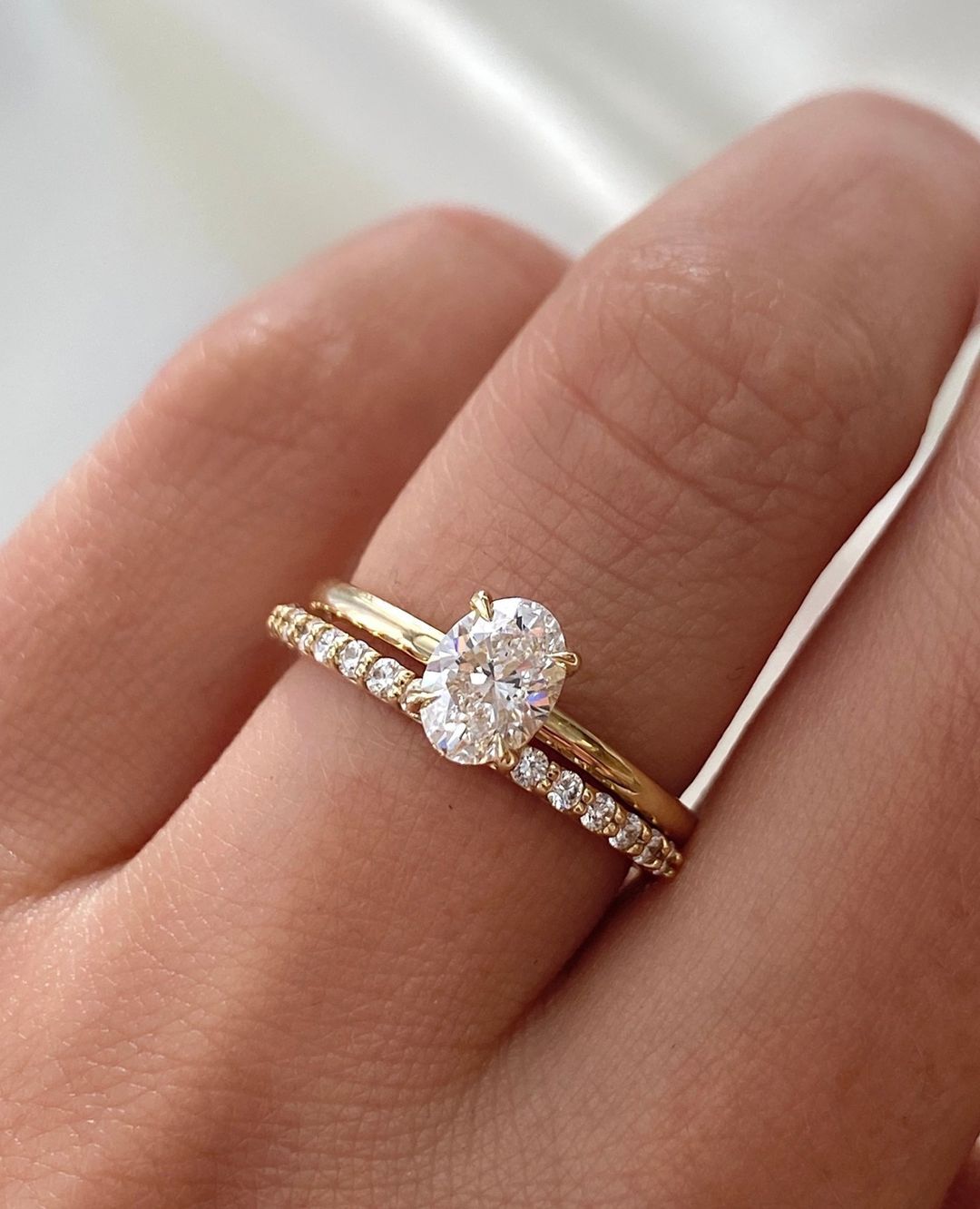 Forever yours. Details: 0.7ct oval Ceremonial Solitaire, nested with our Eternal Ring. Both pieces are crafted in 14K yellow gold.… Wedding Rings Sets Gold, Wedding Bands, Dream Wedding Ring Set, Pretty Wedding Rings, Wedding Rings Sets His And Hers, Stacked Wedding Rings, Yellow Gold Wedding Band, Cute Engagement Rings, Yellow Gold Engagement Ring Oval