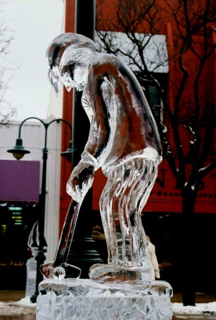 ice impressions michigan ice festival golfer putting ice sculpture