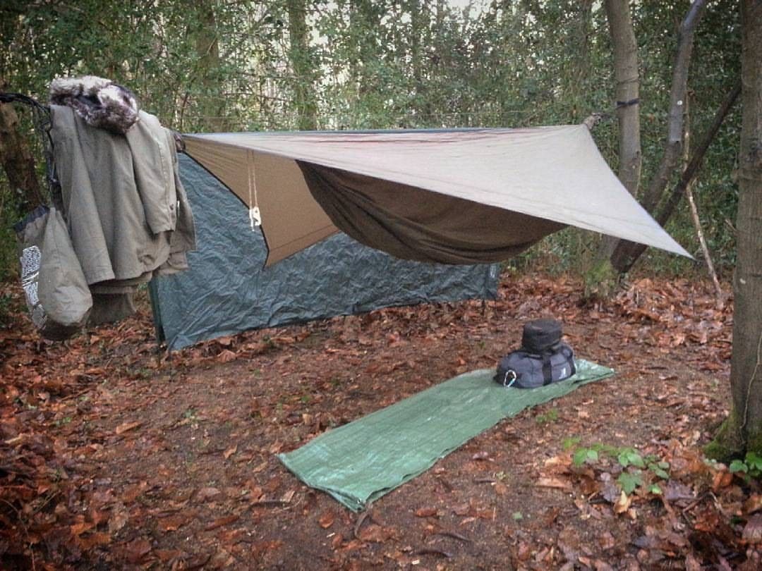 With dd 3x3 tarp behind as a wind break. repost: @island_bushcraft #offgrid #hunting #fishing #camping #hiking #cabin #winter #snow #offgridmovement ...