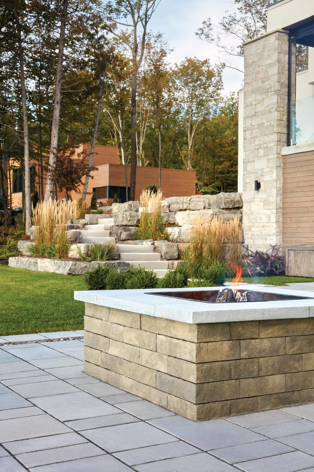Choose from clever or classic finishes, in made-to-match colors that harmonize perfectly with our other stone features. Whether you're seeking clean and contemporary lines, rustic earthy inspiration, or traditional outdoor spaces, evenings by the fire pit never looked so good in your backyard! Learn more about our wide selection of fire pit ideas for your backyard! Backyard Spaces, Fire Pit Backyard, Outdoor Fire Pit, Backyard Patio, Backyard Landscaping, Outdoor Spaces, Outdoor Living, Outdoor Decor, Outdoor Kitchens