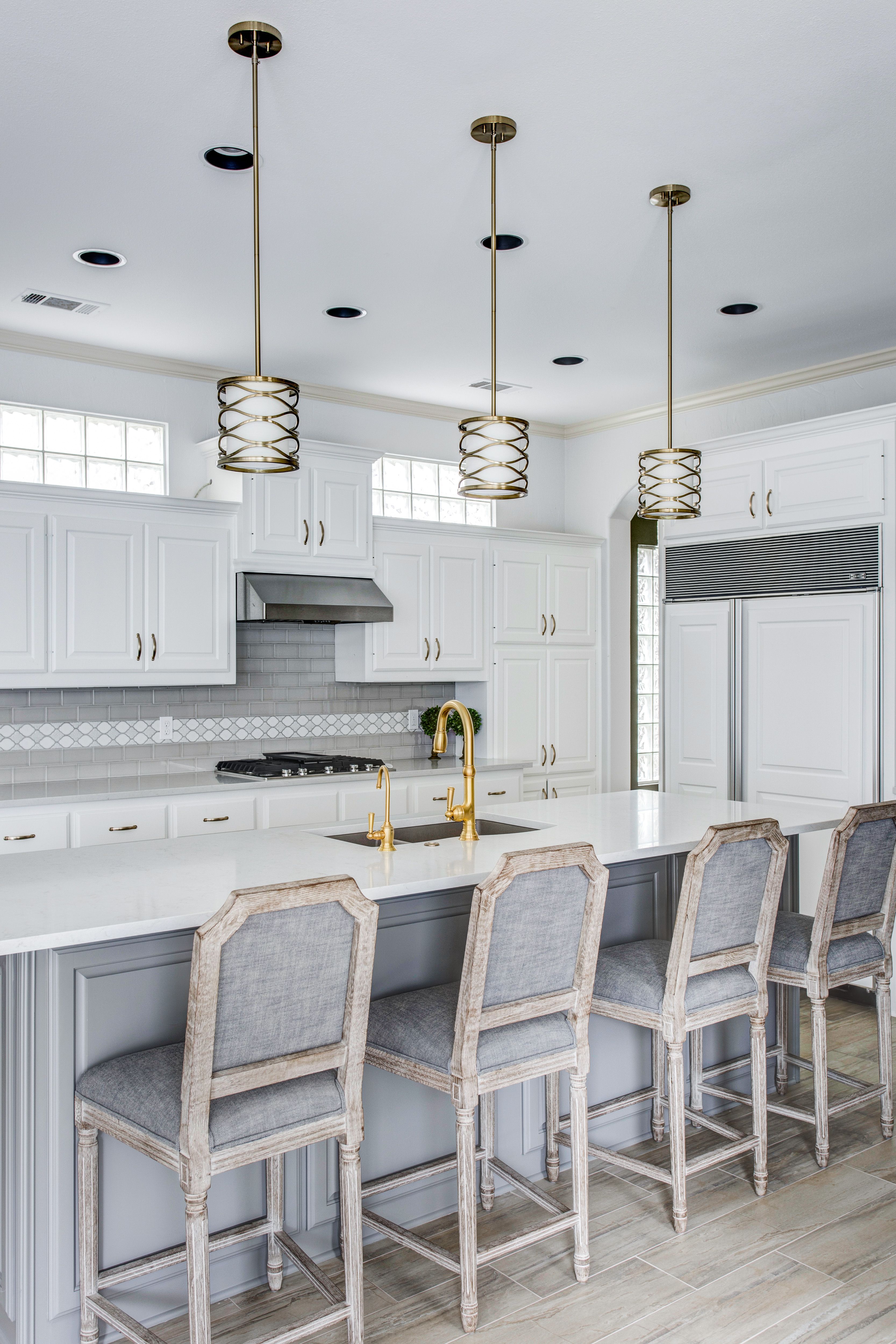 White Cabinets With Grey Subway Tile And A Decorative Glass White Cabinets With Grey Subway Tile And A Decorative Glass