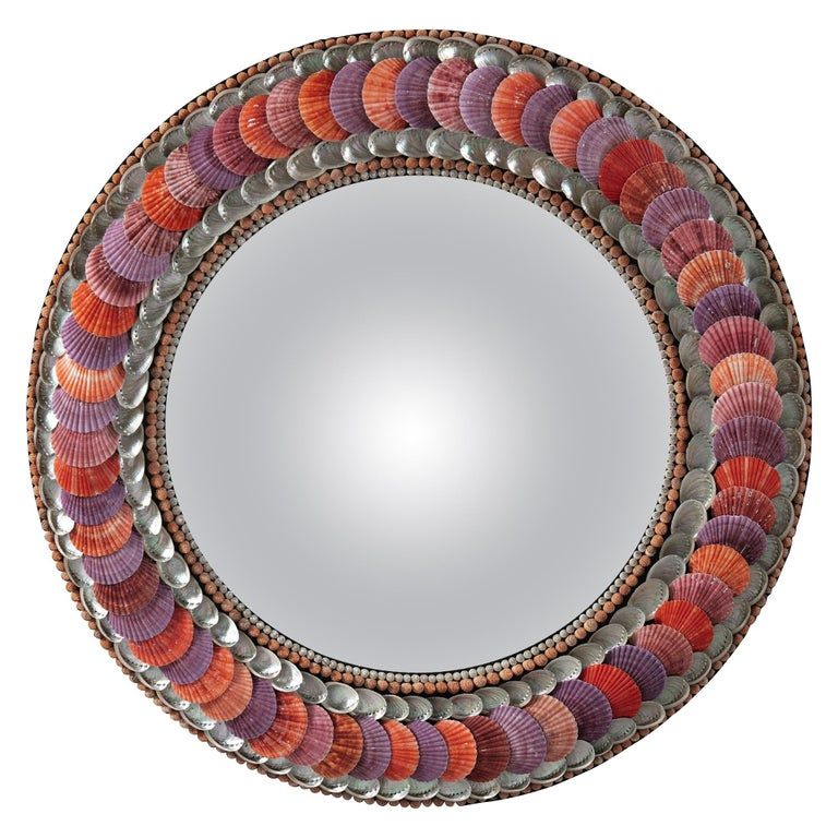 A circular shell mirror with convex mirror plate, the border decorated throughout with shells of varying red and purple hues.. By Tess Morley. Modern Mirror Wall, Diy Mirror, Mirror Plates, Round Mirrors, Purple Mirror, French Walls, Convex Mirror, English Art, Egyptian Jewelry