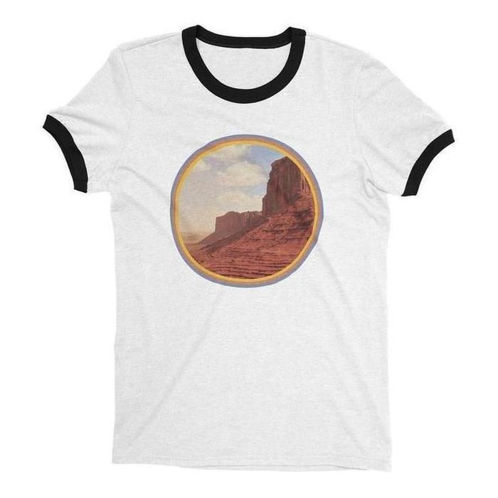 Start tab labels Details Sizing Start tab content Outdoors Vintage 70s style Graphic Tee• vintage inspired shirt• desert landscape graphic T-shirt• women's short sleeve tee• close fit top• 100% cotton• sweatshop free clothing• eco friendly inks• ethically printed in our loft• note: ringer tee has a faded print for an authentic vintage look• the beige ringer is warmer in color person. It's a creamy-beige shirt with brown bands• allow 1-3 working days to print if not in stock Unisex Sizes run BIG Graphic Tees Vintage, Graphic Shirts, Vintage Shirts, 70s Vintage Fashion, 70s Fashion, Vintage 70s, Workout Tops, Workout Shirts