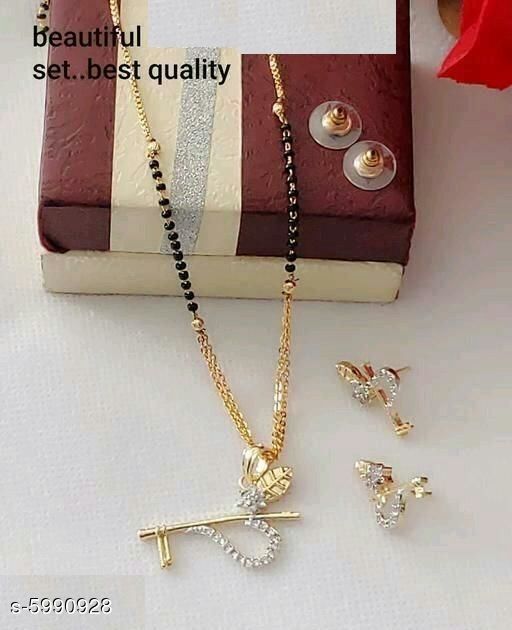 Mangalsutras New Stylish Trendy Mangalsutra Sets *Base Metal* Alloy *Plating* Gold Plated *Stone Type* Artificial Stones *Sizing* Adjustable *Type* Mangalsutra With Earrings *Multipack* 1 *Sizes* Free Size (Length Size *Sizes Available* Free Size * Catalog Rating: ★3.9 (522) Catalog Name: New Stylish Trendy Mangalsutra Sets CatalogID_907509 C77-SC1097 Code: 102-5990928-<> #Accessor... Artificial Stone, Gold Plated Stone, American Diamond, Multipack, Base Metal, Free Size, Gold Necklace, Plating, Trendy
