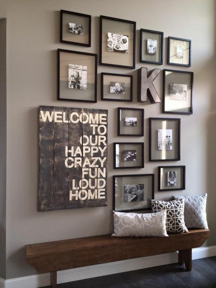 idee deco hall d entree maison avec des cadres noirs aux photos de - idee entree de maison idee deco hall d entree maison avec des cadres noirs aux photos de - idee entree de maison