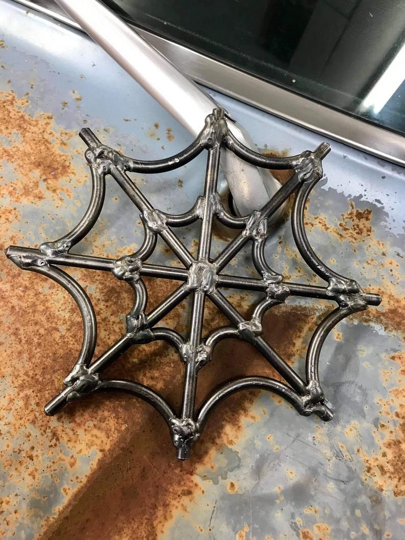 What could be better than a spiderweb that you never need to get rid of? This spiderweb is made from bolts. Each bolt is cut down to size and then they are bent and welded together. Each web is made by hand and each bolt is hand bent to the spiderweb shape before being welded together. Cool Welding Projects, Welded Metal Projects, Welding Crafts, Metal Working Projects, Welding Ideas, Diy Welding, Blacksmith Projects, Diy Projects, Metal Welding Art
