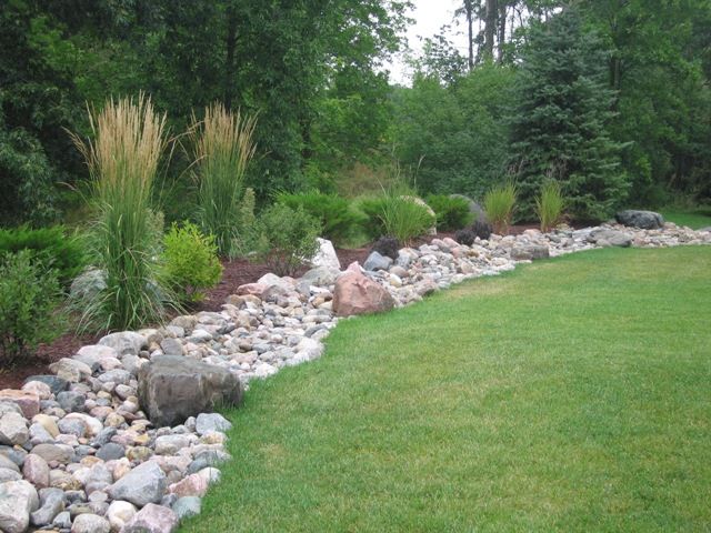 For Bottom Of Hill In Backyard Maybe Do A Border Between Grass And Gravel Landscaping On A Hill Backyard Landscaping Landscaping With Rocks