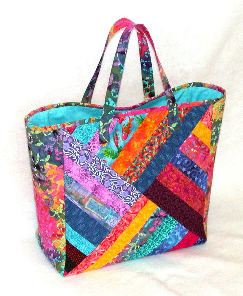 When I made a quilt several years ago, I accidentally cut a few of the blocks with the diagonals circling the center clockwise instead of counter-clockwise, as the rest were cut. No matter. The extra blocks worked fine when I finally got them back out of my UFO drawer recently and made them into this quilted patchwork tote. The bag is 15.5 x 15.5 x 7.5 inches, a great size for doing some serious shopping. 20150228_24-A Tote Bags Sewing, Quilted Tote Bags, Sewing Purses, Quilted Totes, Quilted Purses, Patchwork Bags, Tote Purse, Crazy Patchwork, Patchwork Quilting