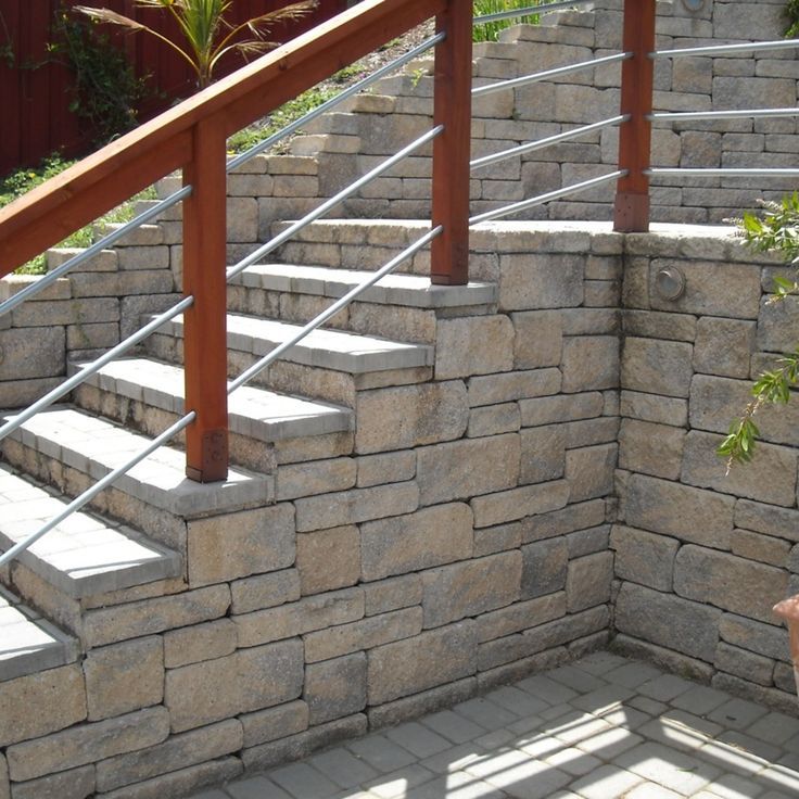 Is soil erosion a problem in your landscape? A retaining wall is an effective solution for not only sloped landscapes, but can provide a beautiful aesthetic to your overall landscape design. To discover more about the options available, reach out to PBM today. 📷 Calstone Landscaping A Slope, Wall Seating, Retaining Wall, Building Materials, Outdoor Walls, Garden Arch, Landscape Design, Natural Stones, Residential