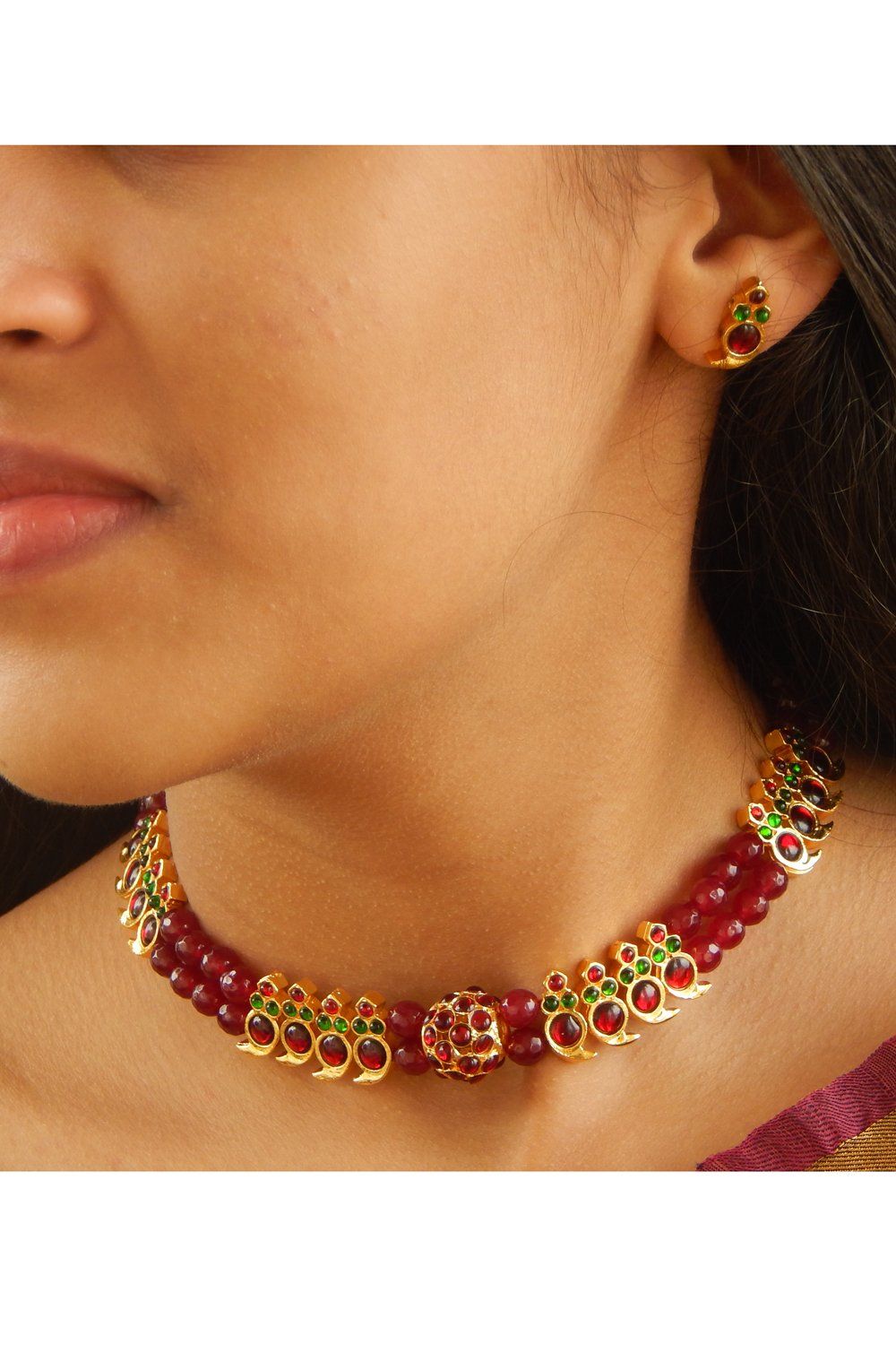 Product Features: Color: Gold, Maroon and Green Material: Alloy Design: Traditional and Contemporary Necklace Length (w/o dori): 27 cm Dori Length: 26 cm Earring Height: 1.8 cm Earring Width: 0.5 cm Product Weight: 70 Gram Occasion: Ethnic, Traditional, Festive Disclaimer: There will be slight difference in digital to actual image Chocker Necklace, Necklace Set, Necklace Lengths, Earrings, Contemporary Necklace, Green Materials, Gram, Maroon, Ethnic