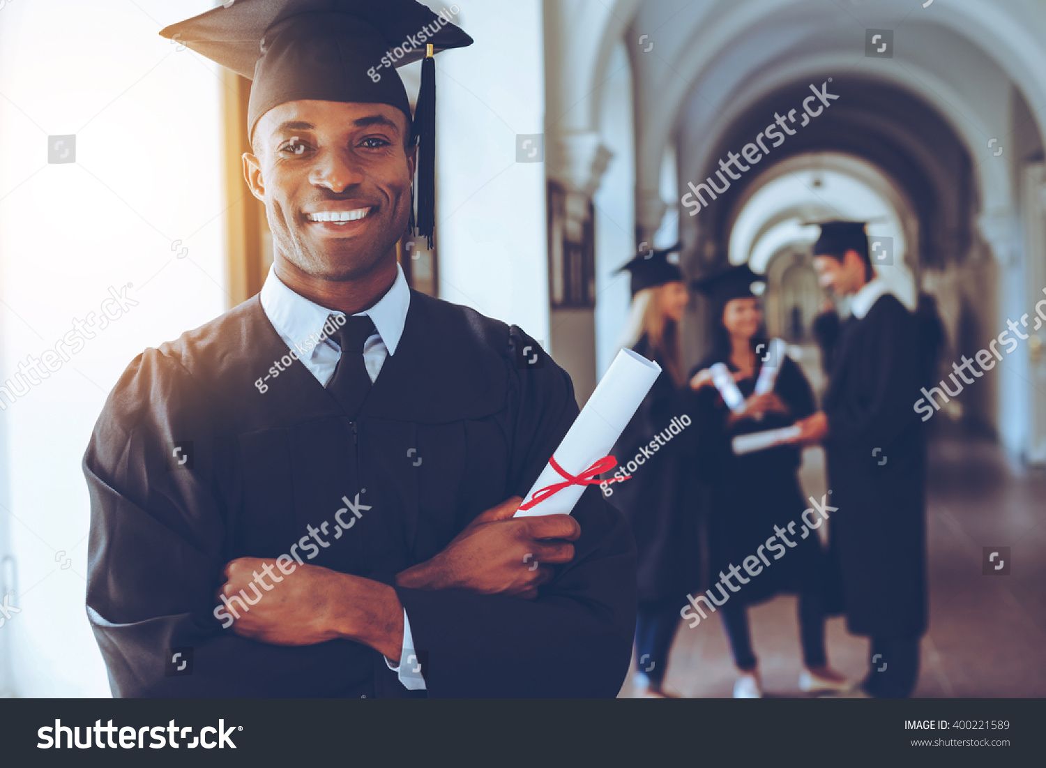 Happy Graduate Happy African Man In Graduation Gowns Holdin Ad
