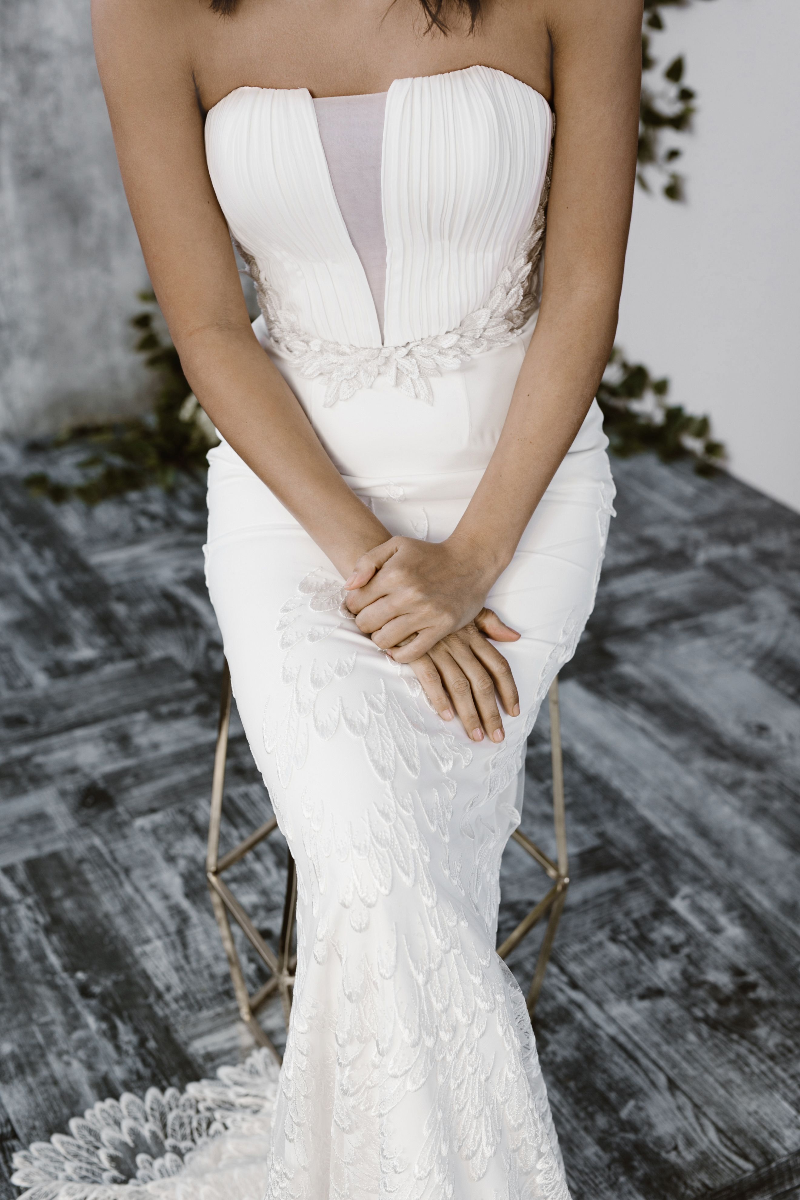 Nike gown. Pleated bustier with embroidered skirt hemline and custom