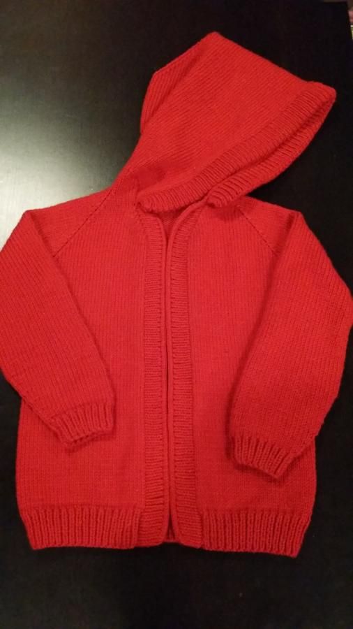Red fleece Sweater with a Trolley Patch.
