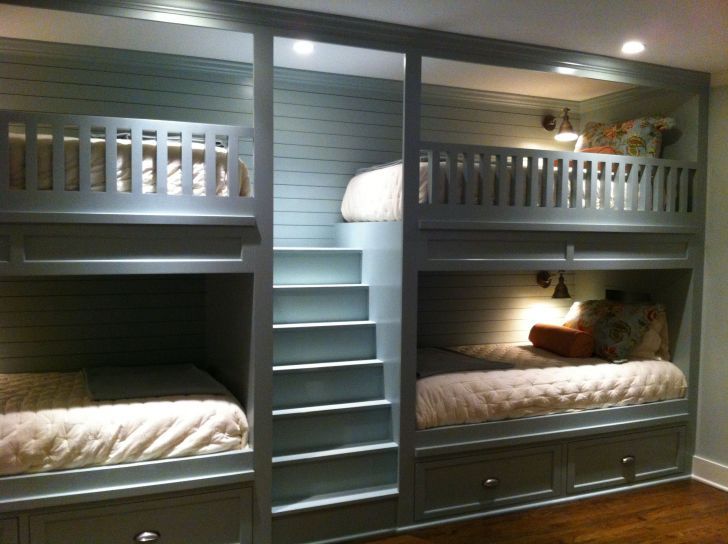 bunk beds with double bed at bottom