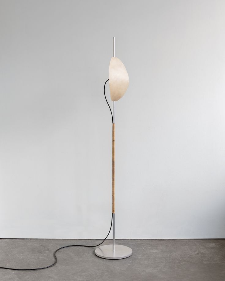 Deas is a minimal floor lamp created by Vancouver-based designer Calen Knauf for Galerie Philia. The Deas is an accent floor light consisting of a solid, waxed aluminum main support and base, hand wrapped in rattan. The diffuser reflector is hand shaped rawhide illuminated by an LED luminaire. Mandala, Floor Lights, Floor Lamps, Rawhide, Hand Shapes, Lamp Design, Rattan, Diffuser, Minimalism