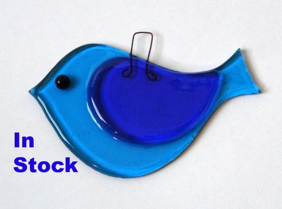 These tack-fused glass birds are one of my best sellers at fairs. They are great to hang in a window, on a twig branch or Christmas tree. The include a copper wire hook from which they can be suspended. They make great gifts anytime of the year. Colours in stock: Confetti and plum - 2 in stock Broken Glass Art, Sea Glass Art, Stained Glass Art, Stained Glass Windows, Window Glass, Diy Window, Glass Art Design, Finding A Hobby, Fused Glass Ornaments
