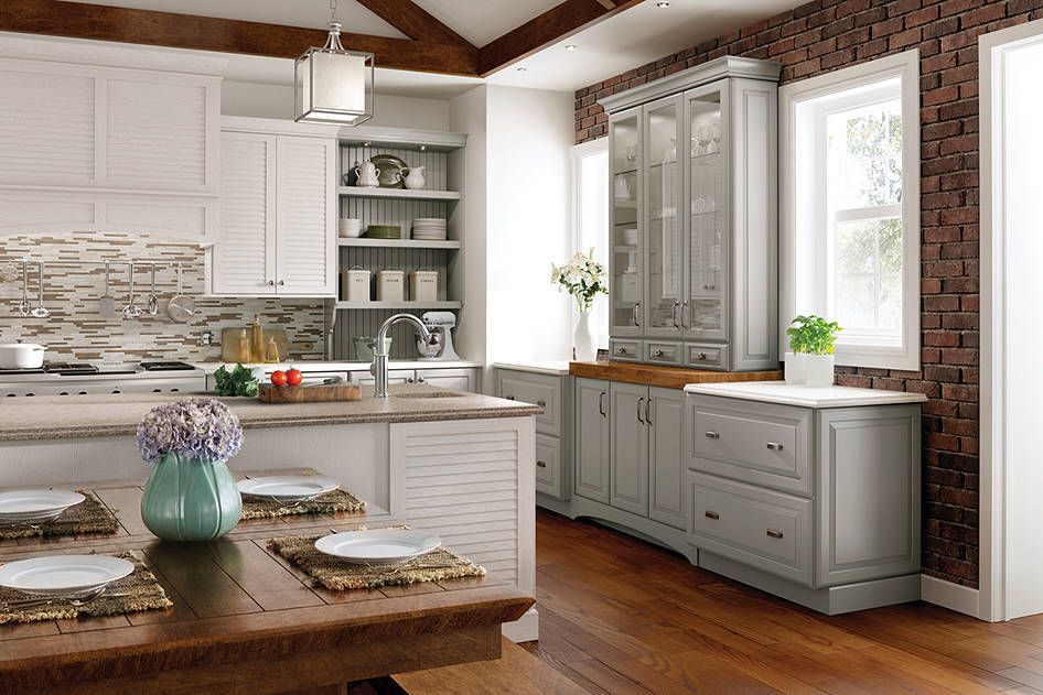 A WoodMode breakfast nook set with banquette seating is a
