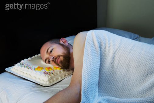 A Man Contemplating The Mistakes He S Made While Using A Cake As A