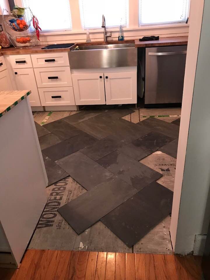 Laying out the black slate tile pattern. Kitchen remodel, Black slate tiles, Slate tile