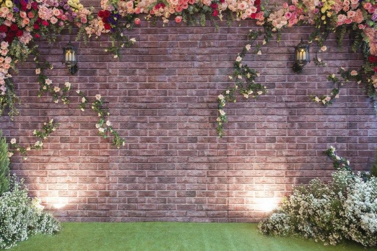 17 Inspiring And Unique Backdrops For Your Ceremony That Are Not Just Flower Arbors Brick Backdrops Brick Wall Backdrop Photo Backdrop Wedding