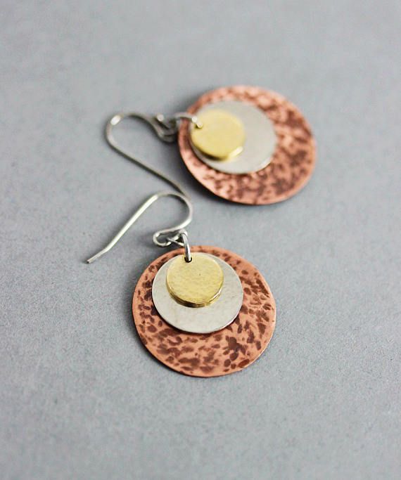 minimalistic modern earrings are made of hand cut copper sheet disks how to cut copper sheet for jewelry