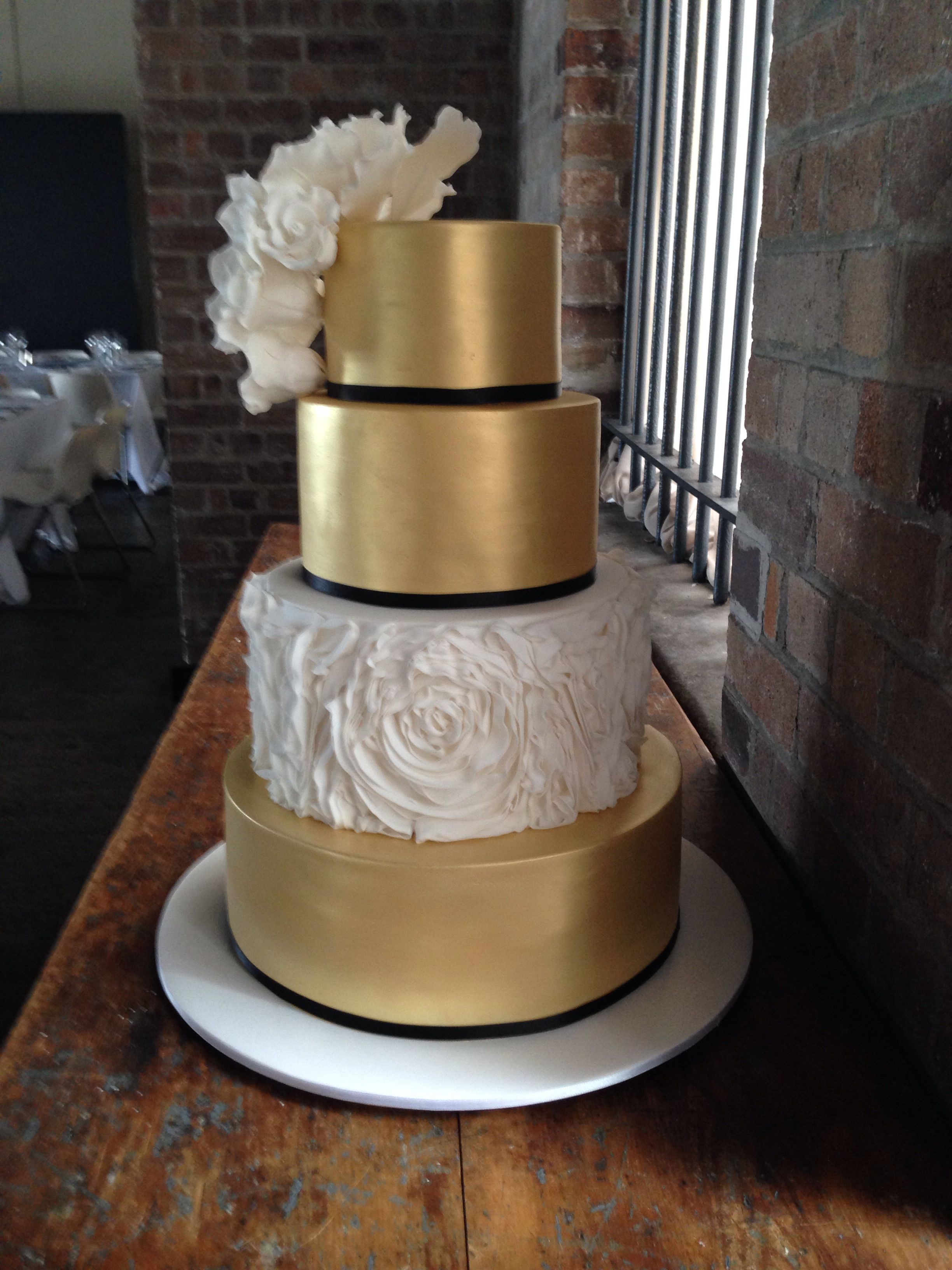 Small, 2 tier version of something like this. Gold and white wedding