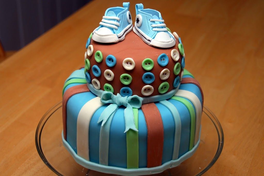 I had done a post called Cake Making 101, and I promised there would be a follow up. Here it is. I was hired to make the following cake for a baby shower. Cakes are basically a hobby for me, but I do agree to do one for a friend every once in a while. The theme of the baby shower was “Cute as a Button.” If you have never… <a href="http://meaningfulmama.com/2012/02/day-47-cake-making-201.html">{Read More}</a> Baby Boy Cakes, Cakes For Boys, Baby Shower Cakes, Fondant Cakes, Cupcake Cakes, Cupcakes, Fondant Icing, Beautiful Cakes, Amazing Cakes