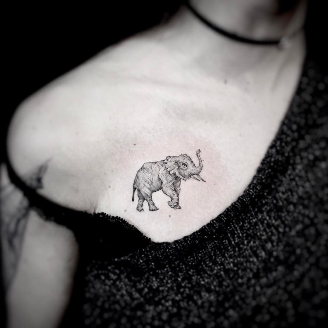 small elephant tattoo on the chest Elephant tattoo small