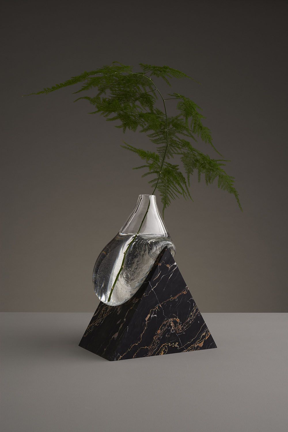 Misshapen Glass Vases By Studio E O Appear To Melt Atop Angular Stone Platforms Vases Decor Diy Vase Vase Design