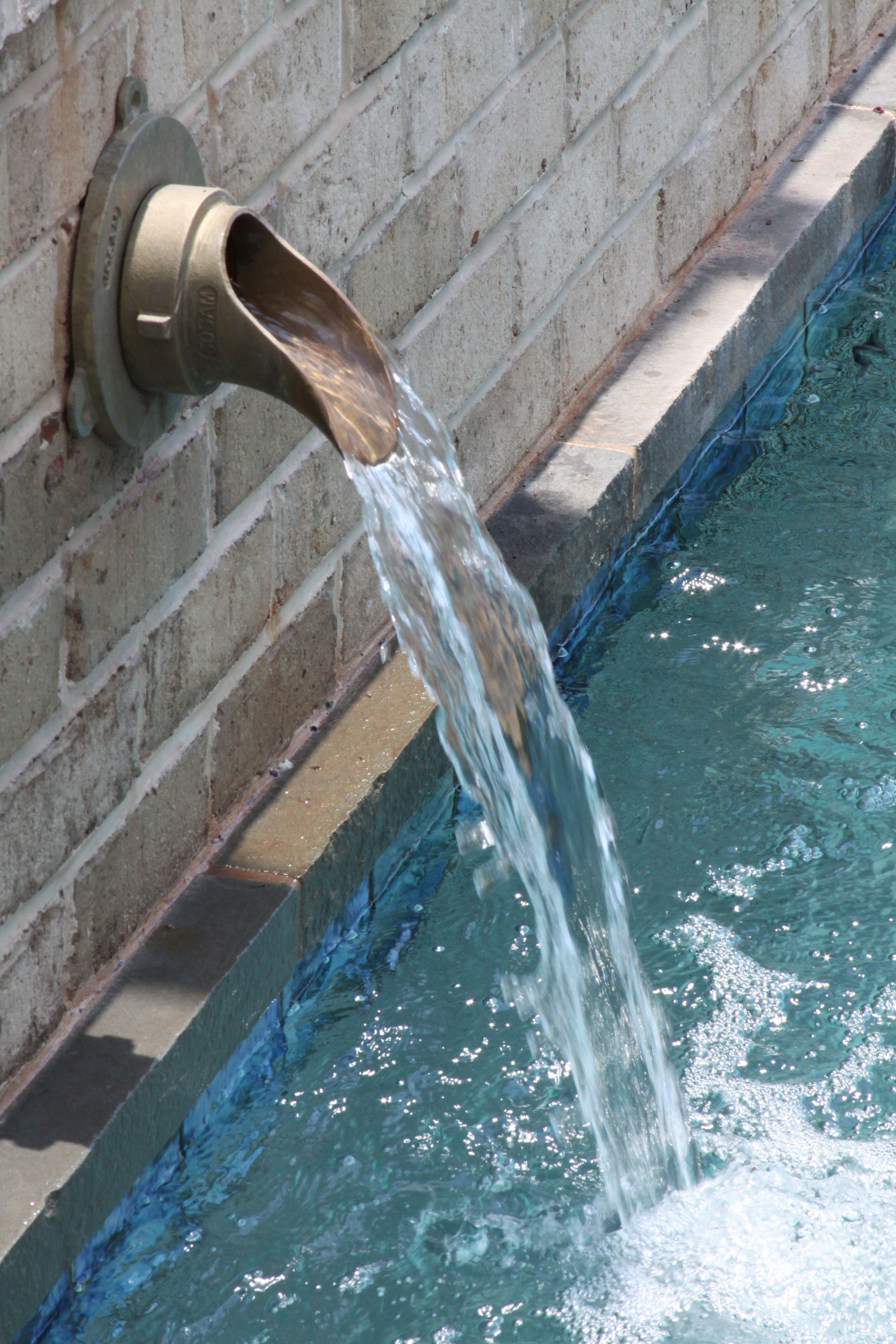 One of the coolest spouts we've put in a pool. Pool water features