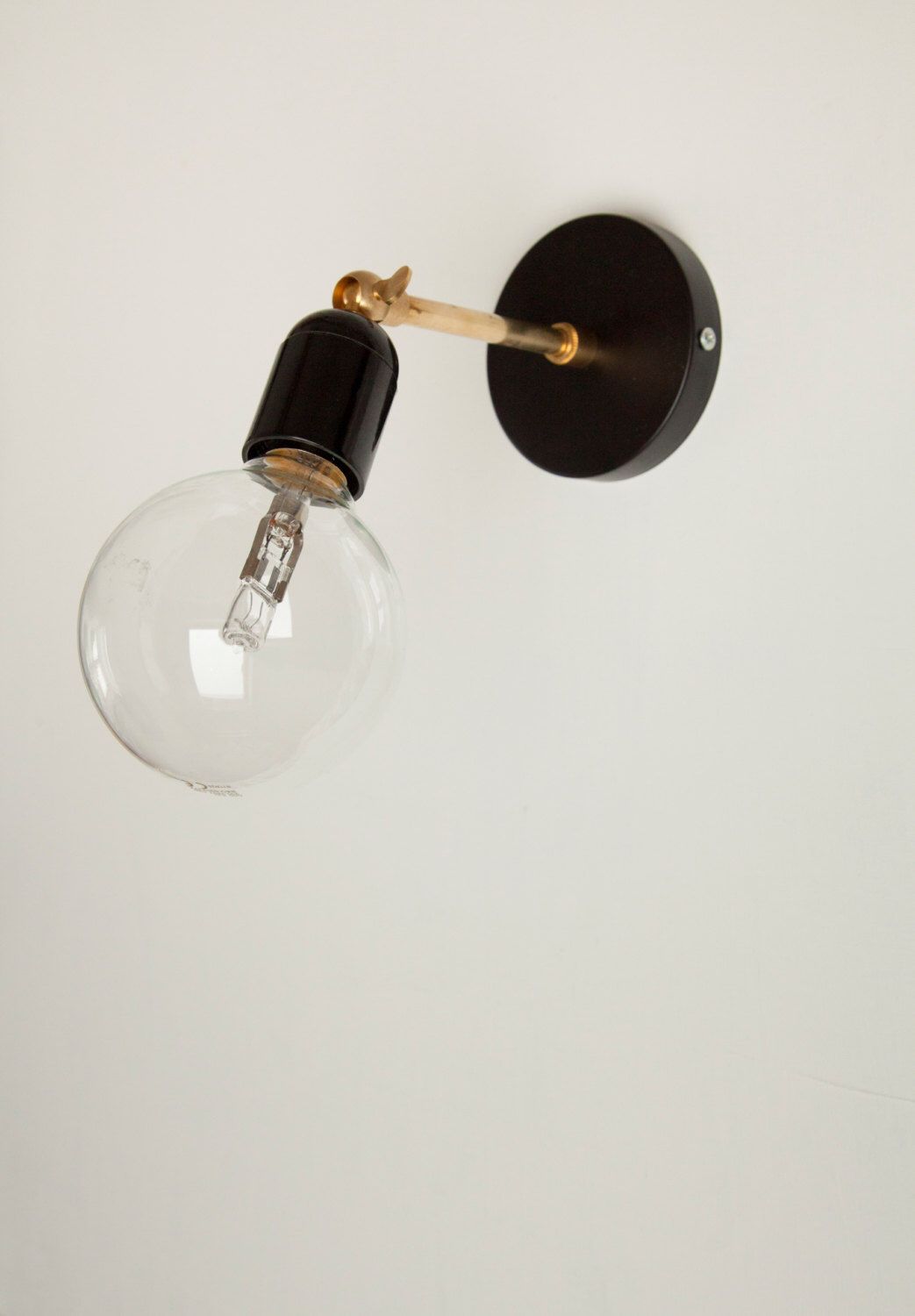 Brass Wall sconce light with black Bakelite lamp holder and brass Brass Wall sconce light with black Bakelite lamp holder and brass