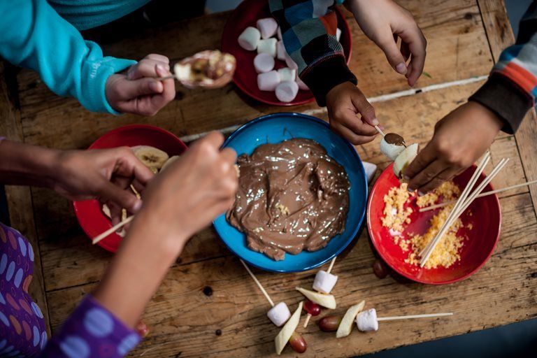 Chocolate fondue with marshmallow and banana #chocolatefonduerecipes An easy, classic chocolate fondue recipe with fruit, with a few twists for added sparkle. #chocolatefonduerecipes