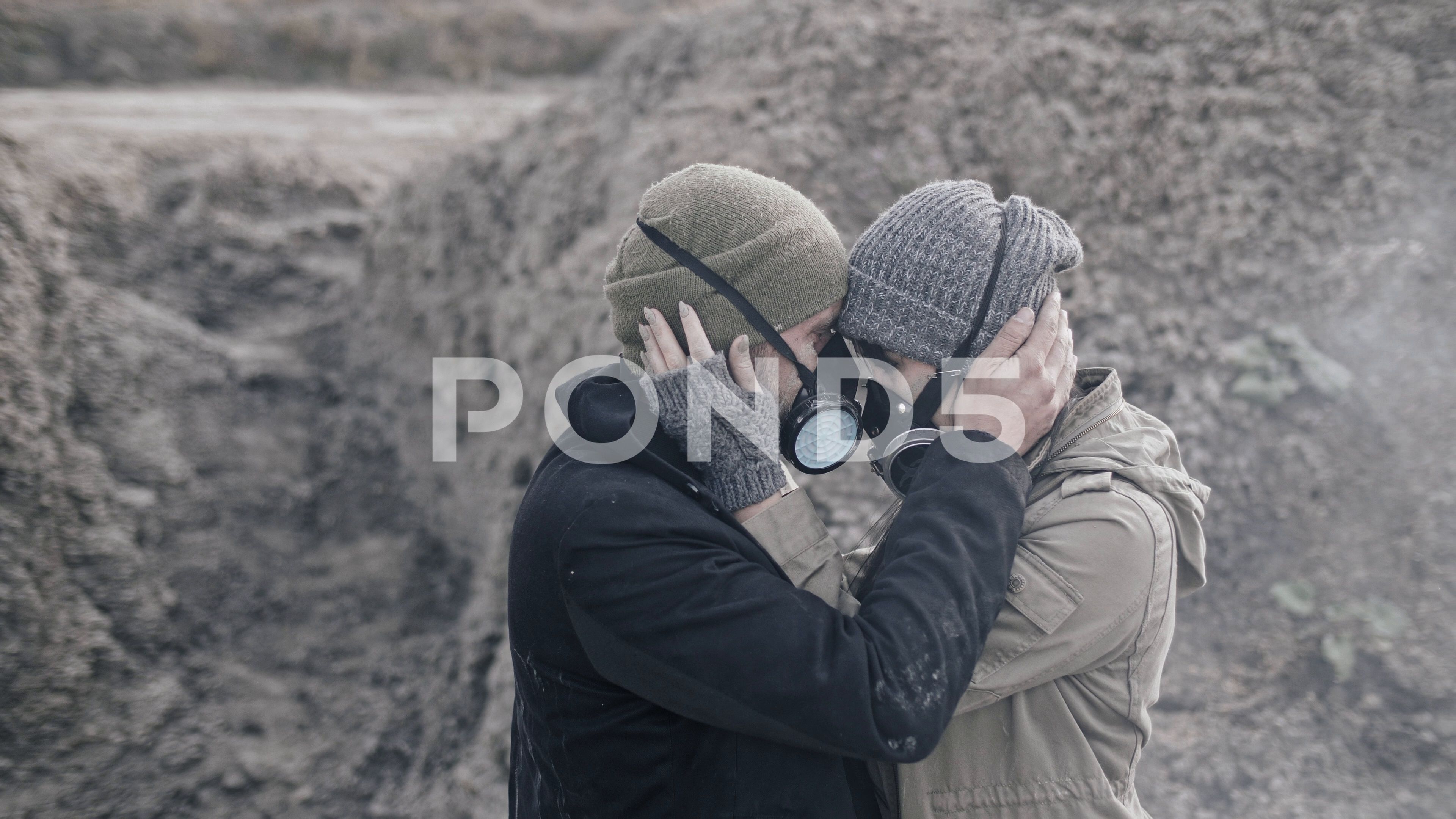 A Survivor Lovely Couple In Gas Mask Hugging In Clouds Of Toxic
